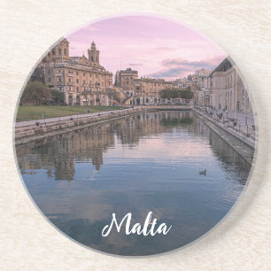 Sunset over small canal in Cospicua, Malta Coaster