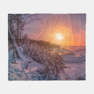Sunset over snow sea coast fleece blanket