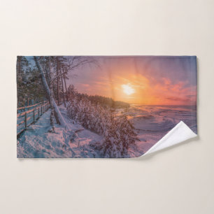 Sunset over snow sea coast hand towel