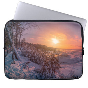 Sunset over snow sea coast laptop sleeve