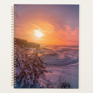 Sunset over snow sea coast planner