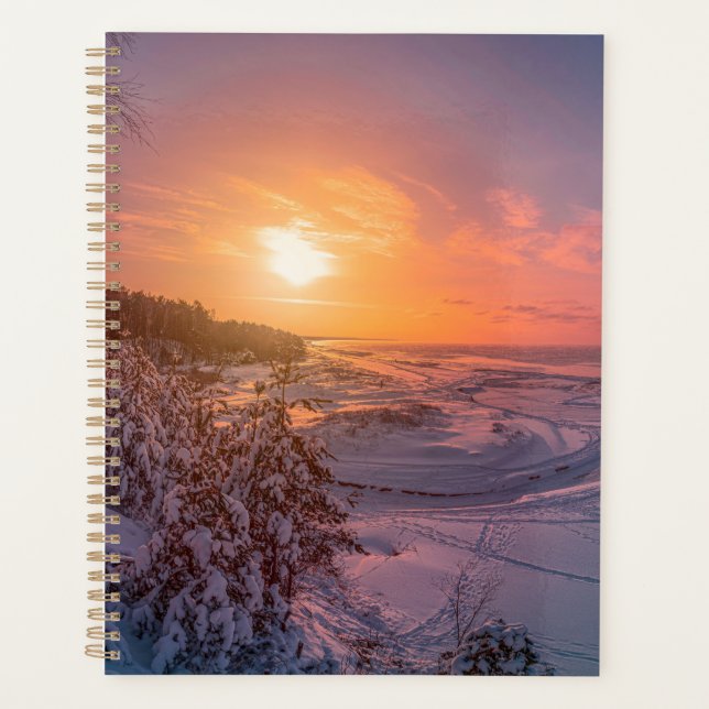 Sunset over snow sea coast planner (Front)