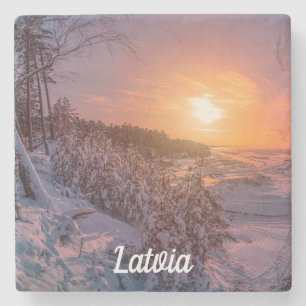 Sunset over snow sea coast stone coaster