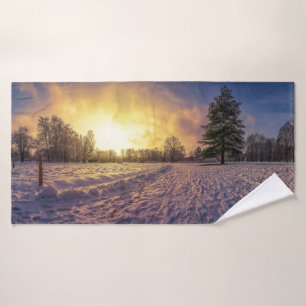 Sunset over snowy winter park bath towel