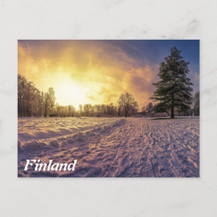 Sunset over snowy winter park postcard