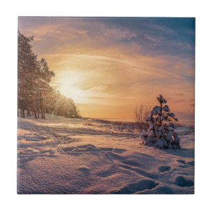 Sunset over snowy winter sea coast ceramic tile