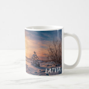 Sunset over snowy winter sea coast coffee mug