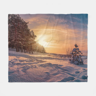 Sunset over snowy winter sea coast fleece blanket