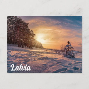 Sunset over snowy winter sea coast postcard