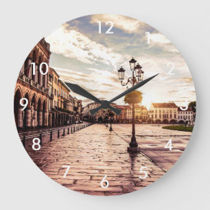 Sunset over square in Padova in Italy Large Clock
