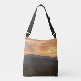 Sunset over the mountains crossbody bag