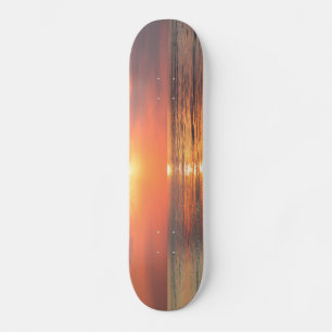 sunset over water skateboard