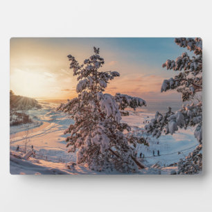 Sunset over winter snowy sea coast plaque