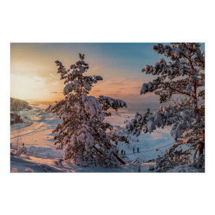 Sunset over winter snowy sea coast poster