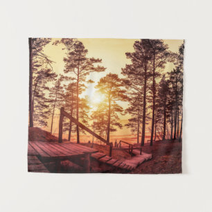 Sunset over wooden path in pine forest tapestry
