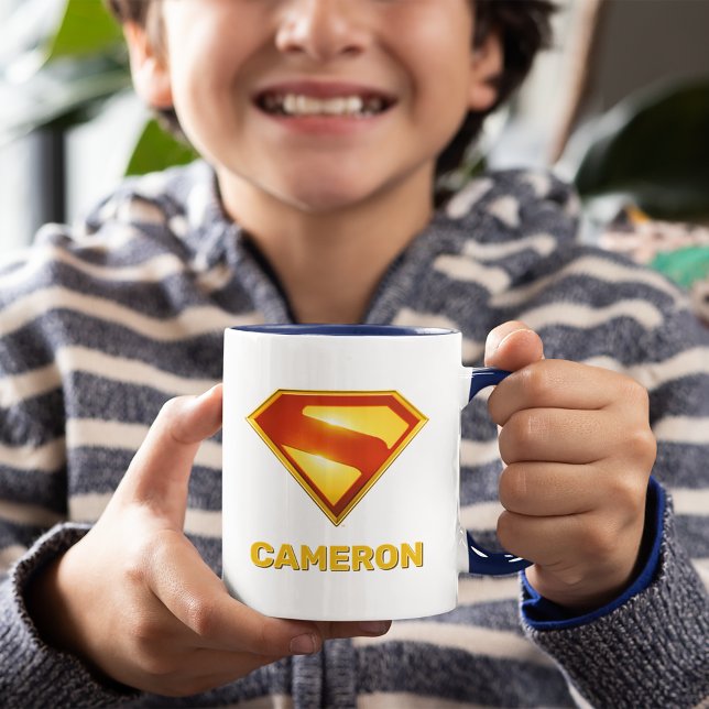 Superman Golden S Shield Brilliance Mug (Kid holding mug)