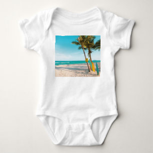 Surf boards on beach throw pillow baby bodysuit