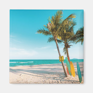 Surf boards on beach throw pillow magnet