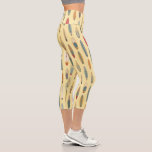 Surf Life | Retro Coastal Surfboard Print Yellow Capri Leggings<br><div class="desc">These unique faded sunshine-yellow retro print leggings will show off your love for the waves while turning heads. Featuring a repeating surfboard pattern inspired by classic coastal surf culture with sun-bleached boards, vintage blues, weathered yellows, and faded reds you’d see stacked outside a surf shop or leaning against a fence...</div>