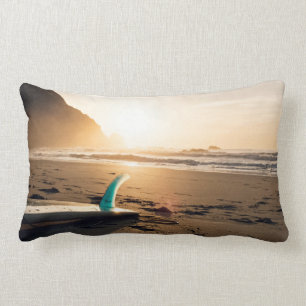 Surf Themed, Surfboard Lays On The Sandy Beach As Lumbar Cushion