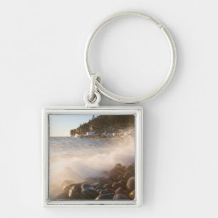 Surf washes over the cobblestones in Monument Key Ring