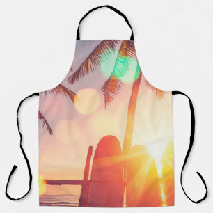 Surfboard and palm tree on beach double exposure w apron