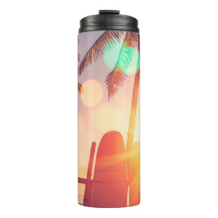 Surfboard and palm tree on beach double exposure w thermal tumbler