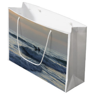 Surfer Awaits Large Gift Bag