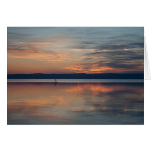 Surfer rowing to shore