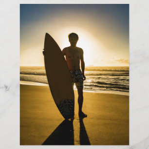 Surfer silhouette during sunrise