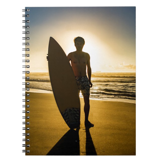 Surfer silhouette during sunrise notebook (Front)