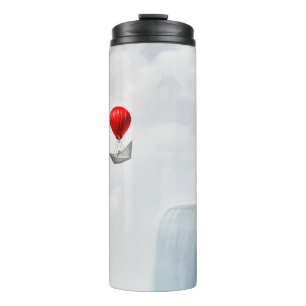 Surreal concept and creative solution metaphor as thermal tumbler