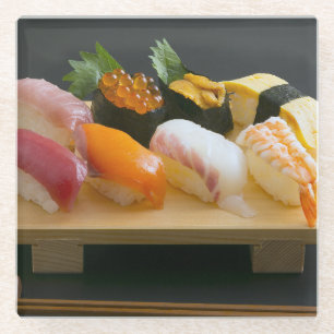 Sushi set - high-quality ingredients arranged on a glass coaster