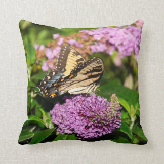 Swallowtail butterfly on lilacs on cushion