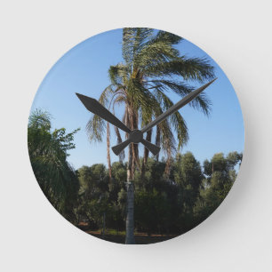 Swaying Palm Tree Under a Clear Sky Round Clock