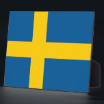 Swedish Flag Plaque<br><div class="desc">Add a touch of Swedish pride to your decor with this elegant plaque featuring the flag of Sweden! Crafted with meticulous attention to detail, this plaque is more than just a decorative item; it's a celebration of Swedish heritage and national pride. The design proudly showcases the iconic flag of Sweden,...</div>