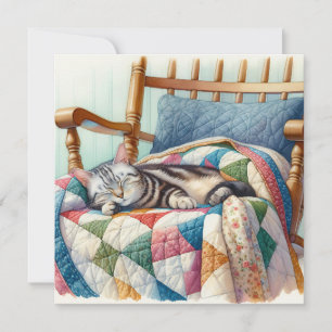 Sweet Grey Cat Sleeping on a Quilt
