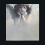 Sweet Rosy Cheeked Vintage Angel in Clouds Notepad<br><div class="desc">Beautiful vintage design of a sweet angel with soft white wings and rosy cheeks,  holding her face in her hands. Looking peaceful and kind. The background is filled with soft ethereal clouds.</div>