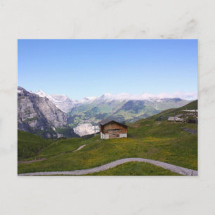 Swiss house and alps postcard