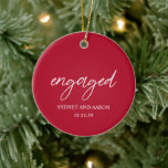 Sydney Red First Christmas Engaged Modern Ceramic Ornament<br><div class="desc">Modern Christmas ornament featuring a contemporary typographic design with "engaged" in elegant script typography along with your names and engagement date in a simple and minimal layout. The back has your favourite photo. The colour theme is red and may be changed the design editing tool. This minimalist style ornament is...</div>