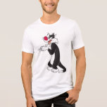 SYLVESTER™ Rubbing Paws Tri-Blend Shirt<br><div class="desc">Bring some mischievous charm to your wardrobe with this Sylvester "Rubbing Paws" t-shirt! Featuring the iconic Looney Tunes cat in a playful and scheming pose, this design captures his classic personality. Made from soft, high-quality fabric, this t-shirt is perfect for fans of Sylvester’s hilarious antics. Customise the fit and colour...</div>