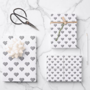 Symmetric Small Concrete Grey Hearts on White Wrapping Paper Sheet