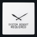 System Reboot Required Minimalist Typewriter Square Wall Clock<br><div class="desc">Time for a change. This modern wall clock features sharp typewriter numerals and a central message reminding you that every hour is an opportunity to reset.</div>
