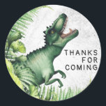 T-Rex Dinosaur Birthday Party Thank You Classic Round Sticker<br><div class="desc">This playful dinosaur-themed party sticker design features a lively green T-Rex peeking out from a jungle of lush ferns with its mouth wide open in a cheerful roar. The textured stone-grey background adds a prehistoric feel, while the bold “Thanks for coming” message in simple, kid-friendly font makes it perfect for...</div>