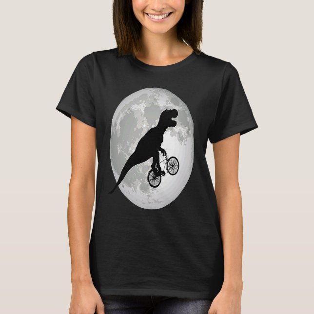 T rex rising bike into the moon in the middle of t T-Shirt (Front)