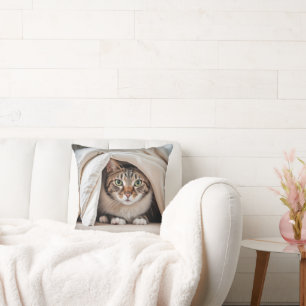 Tabby Cat Hiding Under a Blanket Cushion