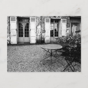 Table in gravel courtyard postcard