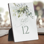 Table Number Greenery Watercolor Wedding Easel Plaque<br><div class="desc">Add a touch of whimsy to your wedding with this enchanting table number plaque adorned with delicate greenery watercolor. The dreamy design effortlessly sets a magical atmosphere for your special day, creating an unforgettable experience for both you and your guests. Each table number sign comes with a complementary easel, ensuring...</div>