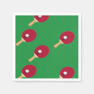 Table tennis racket and ball on green napkin