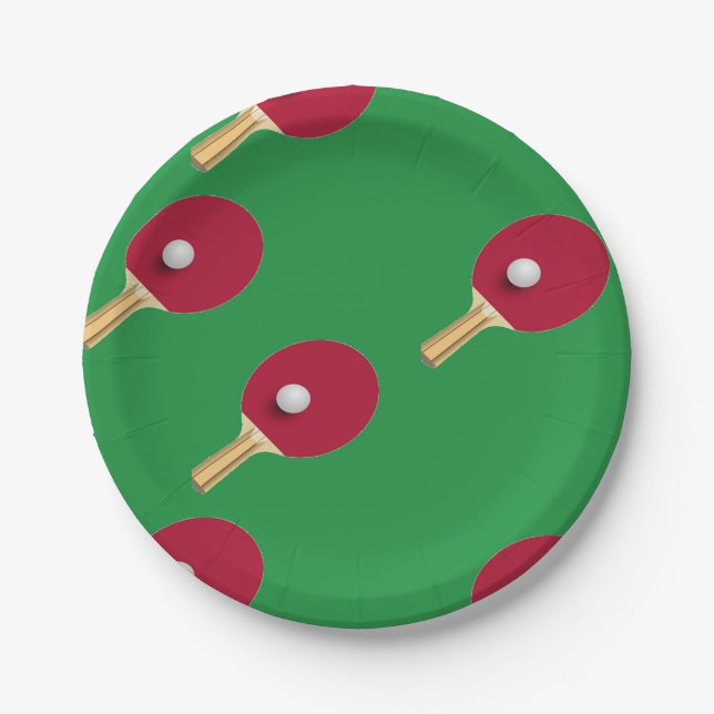 Table tennis racket and ball on green paper plate (Front)